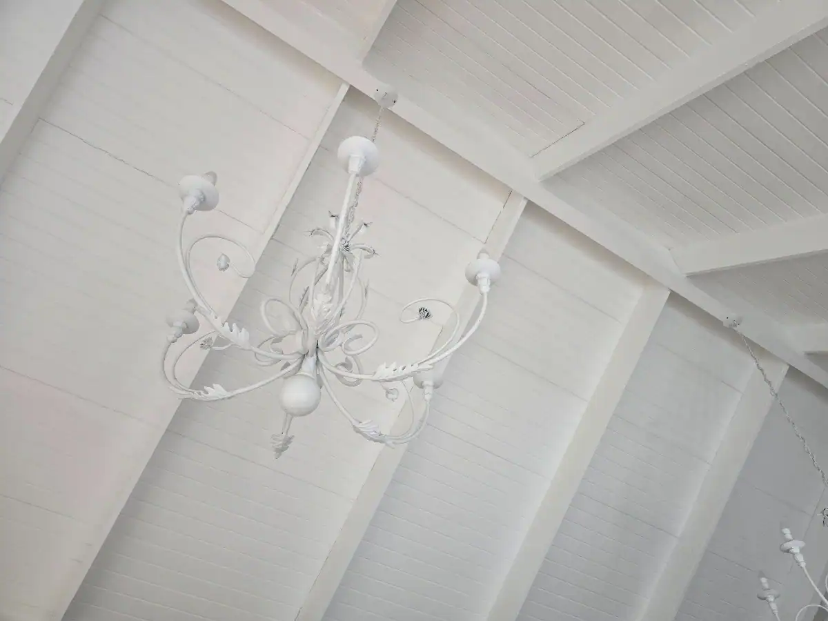 Completed white timber ceiling and exposed trusses after preparation and painting at a Welgemoed home in Bellville