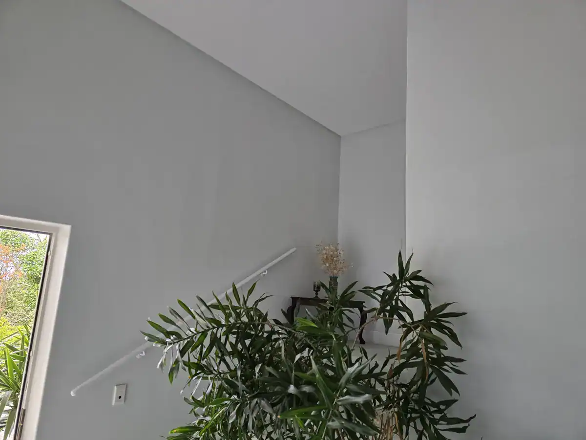 Completed stairwell and interior after damp repairs and painting at a Protea Heights home in Brackenfell