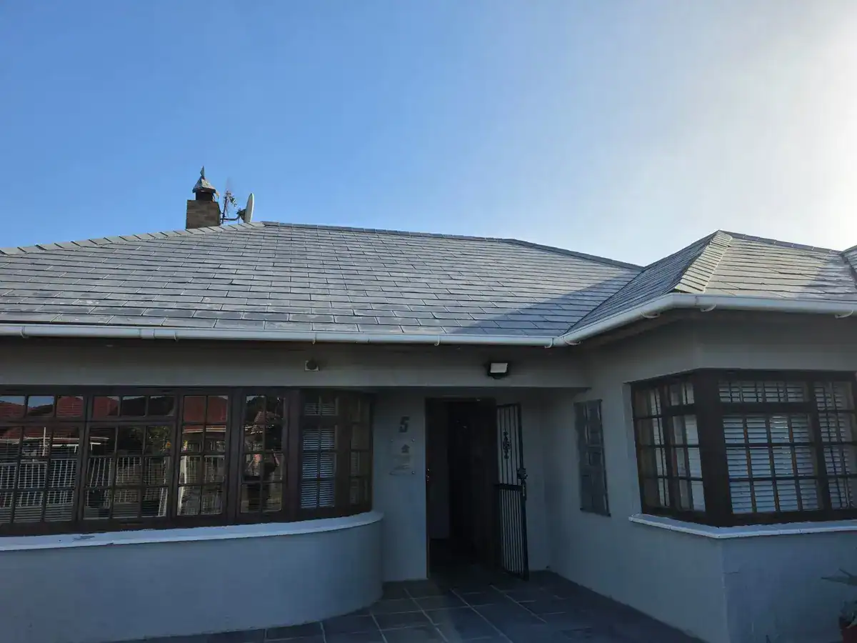 Weathered slate roof before cleaning and painting at a Clara Anna Fontein Estate home