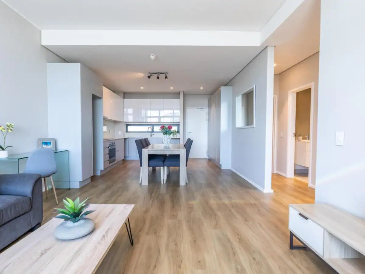 Completed open-plan living and dining area after interior preparation and painting at a Fish Hoek home