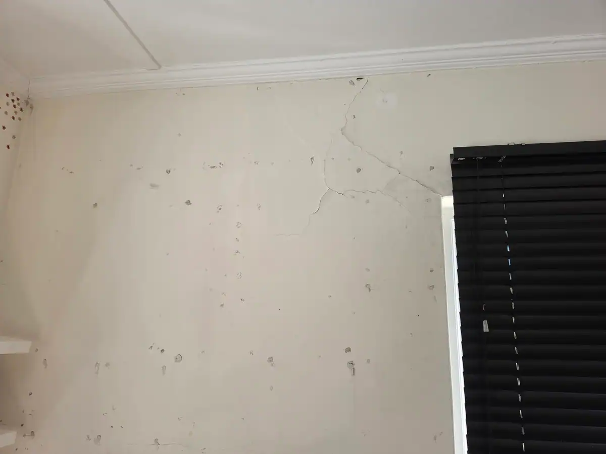 Branching cracks and surface defects before interior repairs at The Stellenberg in Kenilworth Cape Town