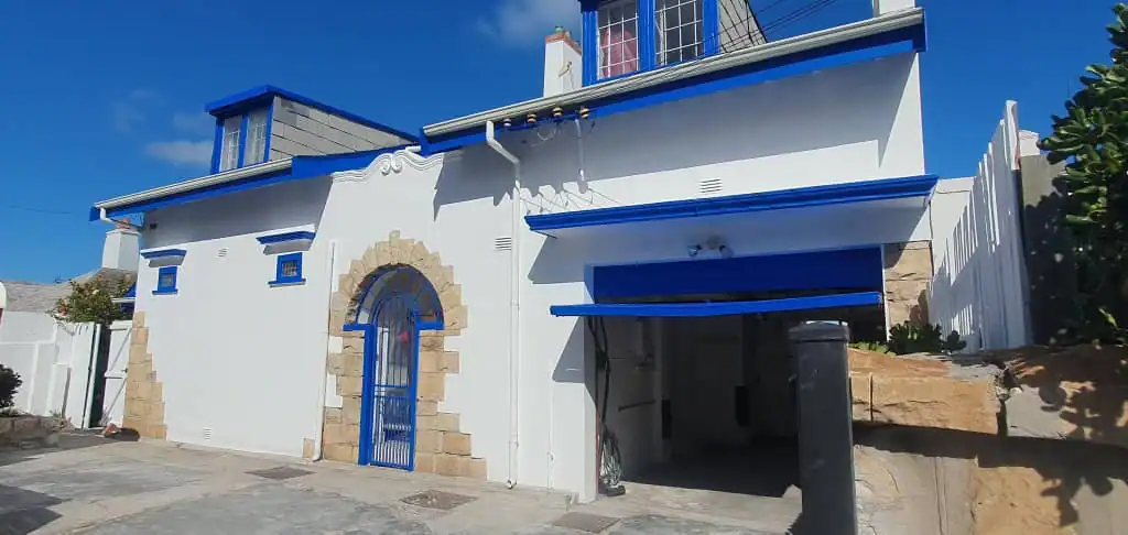 Completed Muizenberg Village coastal home after moisture repairs and exterior painting