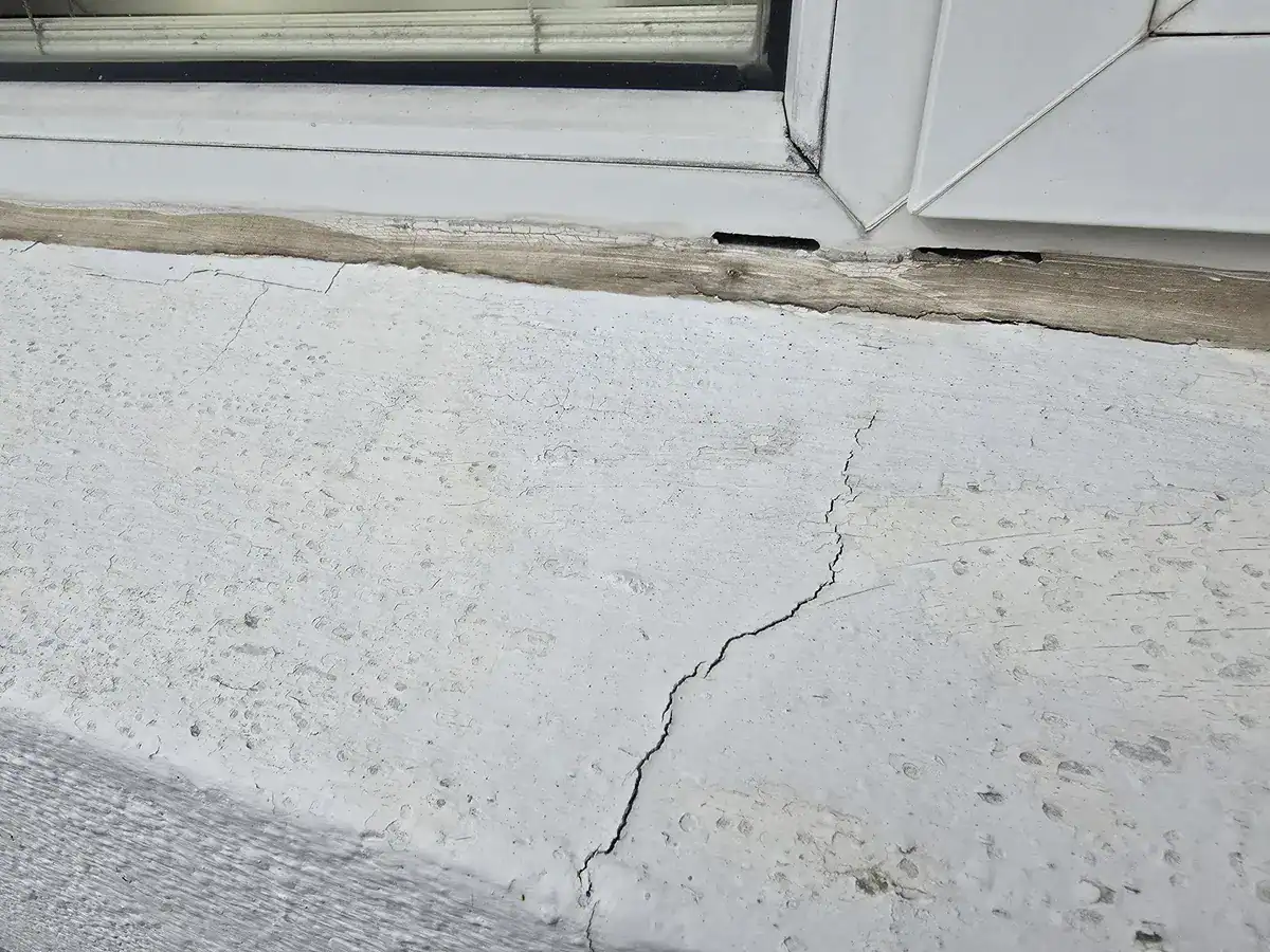 Window-sill cracks and failed detailing before exterior repairs at a Muizenberg Mountainside home