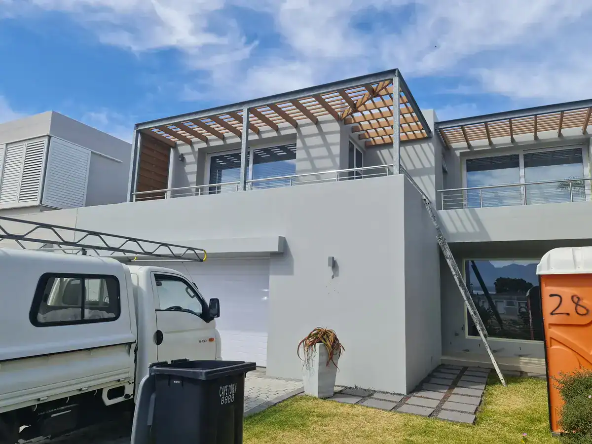 Newly painted exterior walls and architectural features at a private Plattekloof home