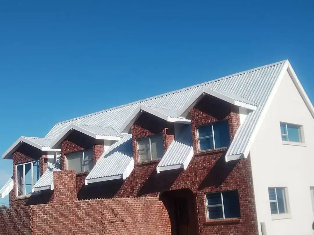 Corrugated metal roof at Ridge Estate Tamboerskloof after application of a full white primer coat