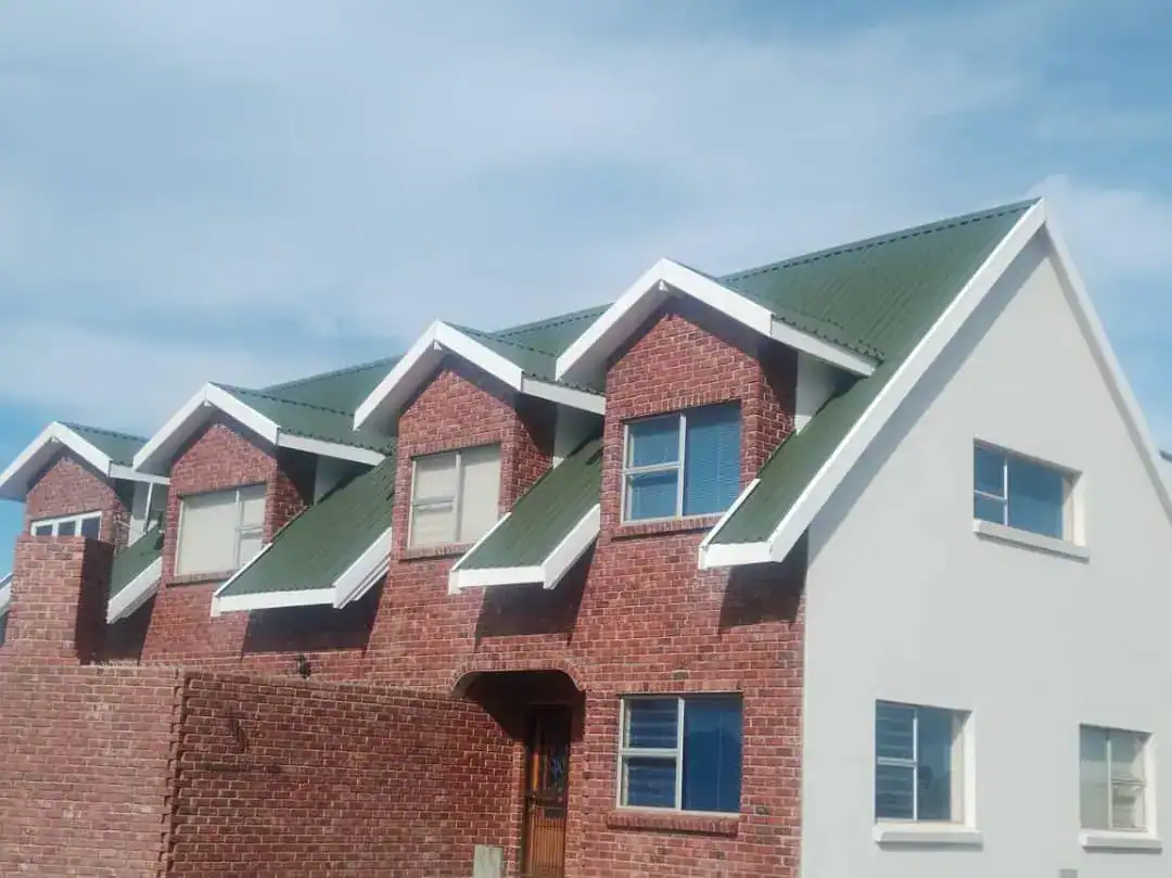 Completed green corrugated metal roof after preparation and painting at Ridge Estate in Tamboerskloof