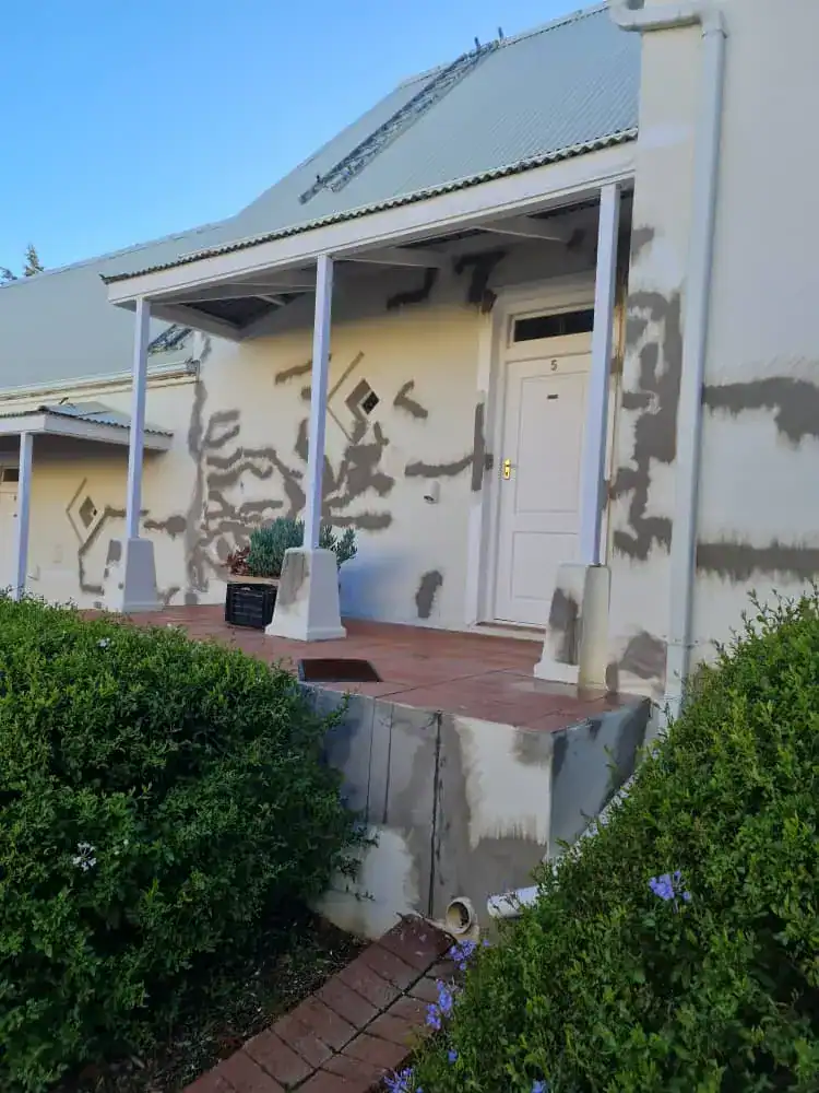 Repaired exterior plaster cracks before repainting at Rozendal Farm in Stellenbosch