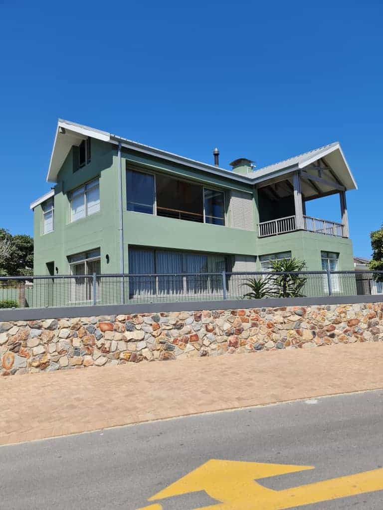 Completed green exterior repaint of a double-storey home in Silverhurst Estate, Constantia