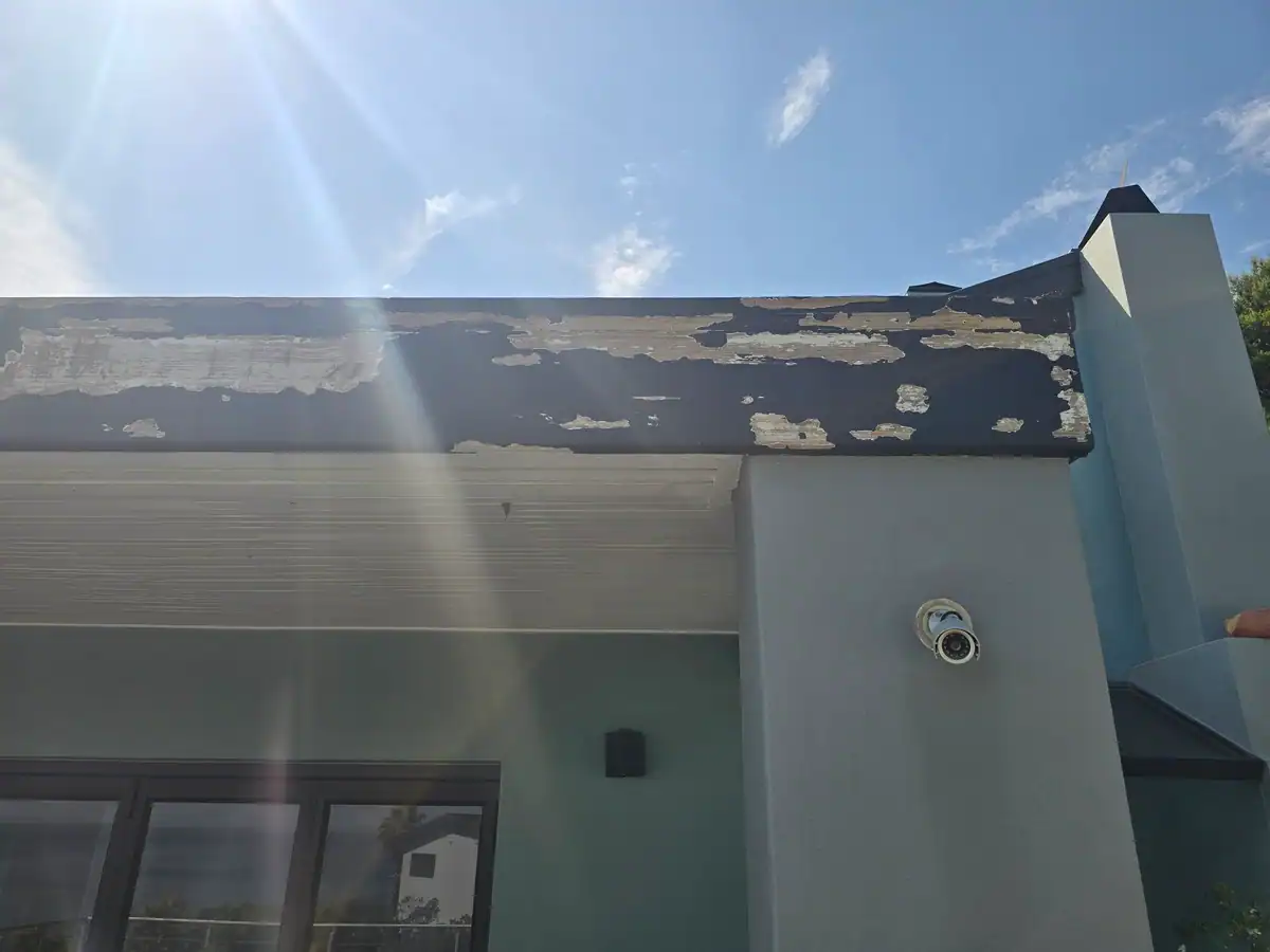 Weathered timber fascia with extensively peeling paint before exterior repairs at a Rocklands Ridge Estate home in Simon’s Town