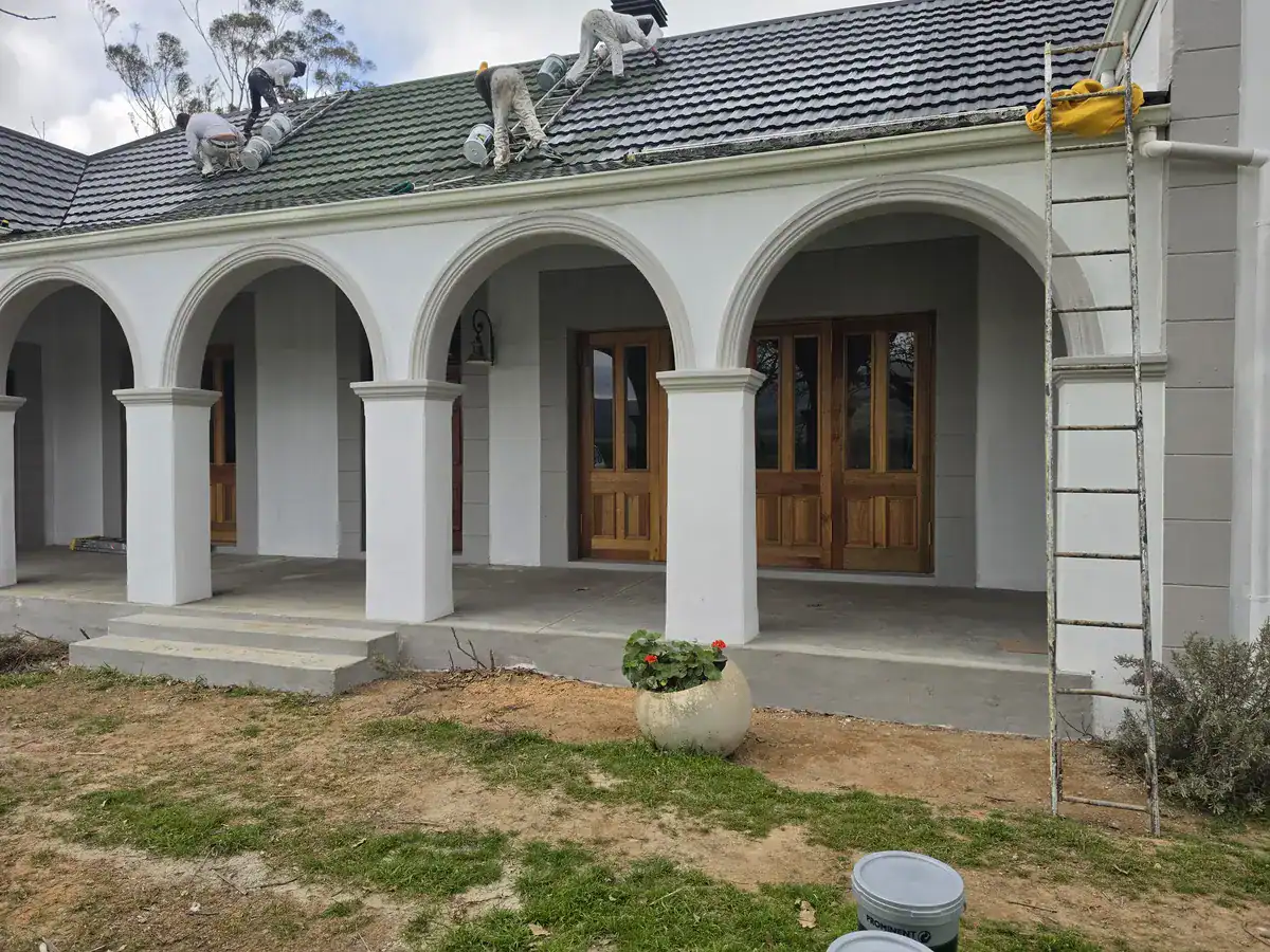 Tiled roof painting in progress at a Paradyskloof home in Stellenbosch