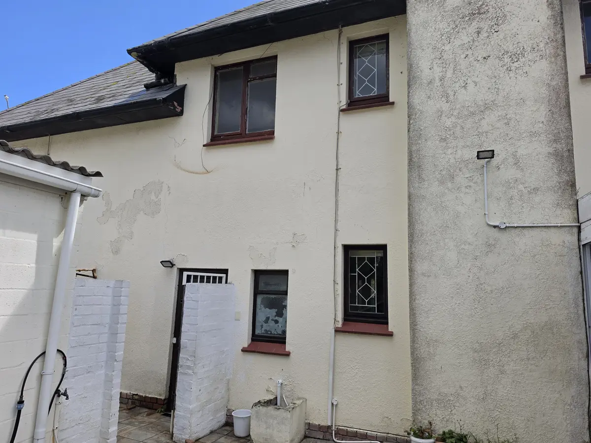 Mould, peeling paint and deteriorated exterior wall before repairs at De Zalze Estate Stellenbosch