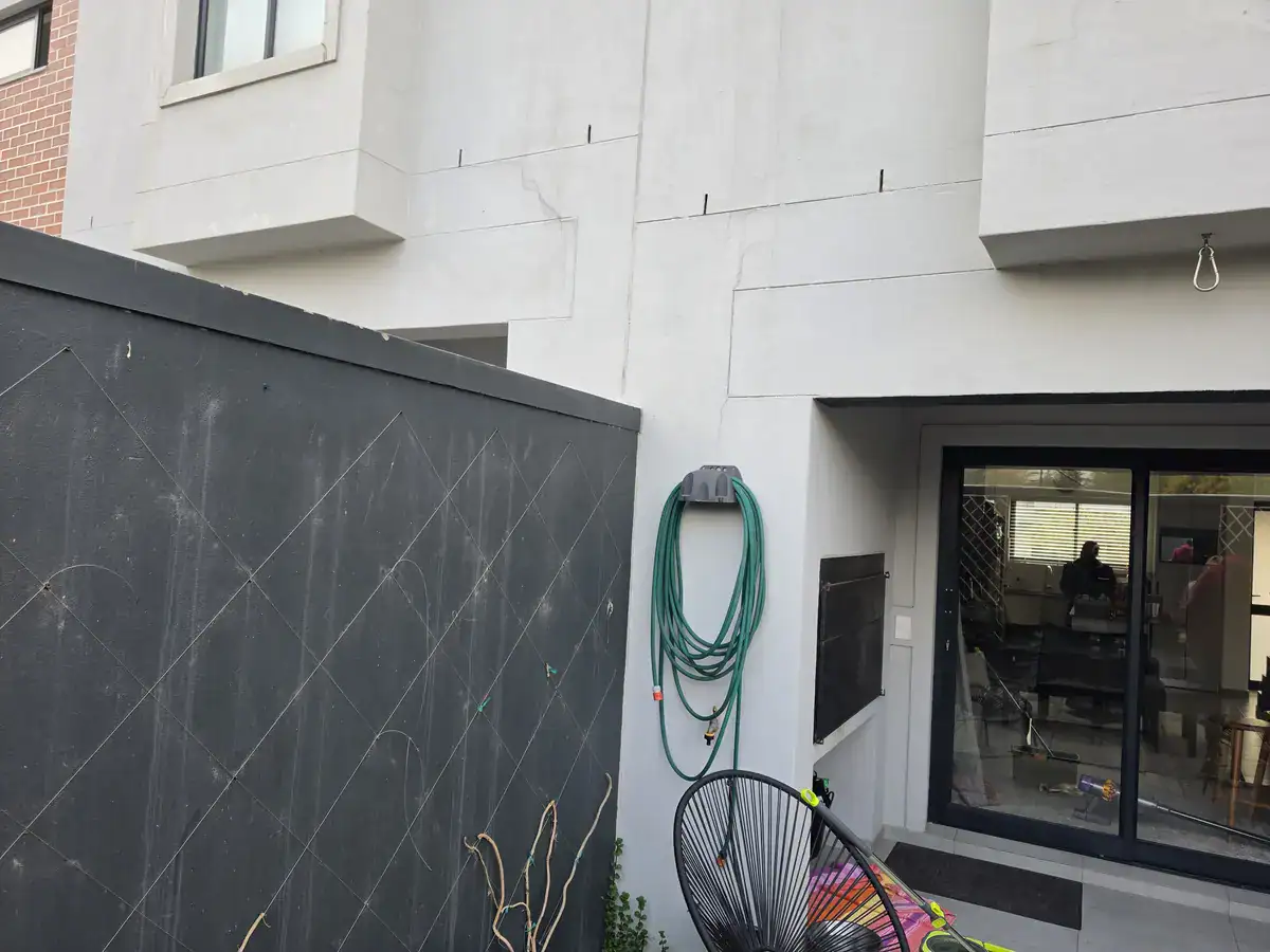 Open expansion joints on D’Landen Estate townhouse exterior before flexible sealing