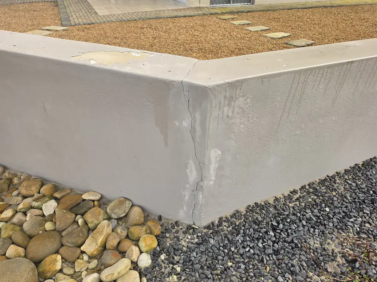 Cracked and weathered boundary wall in Durbanville before repairs and repainting