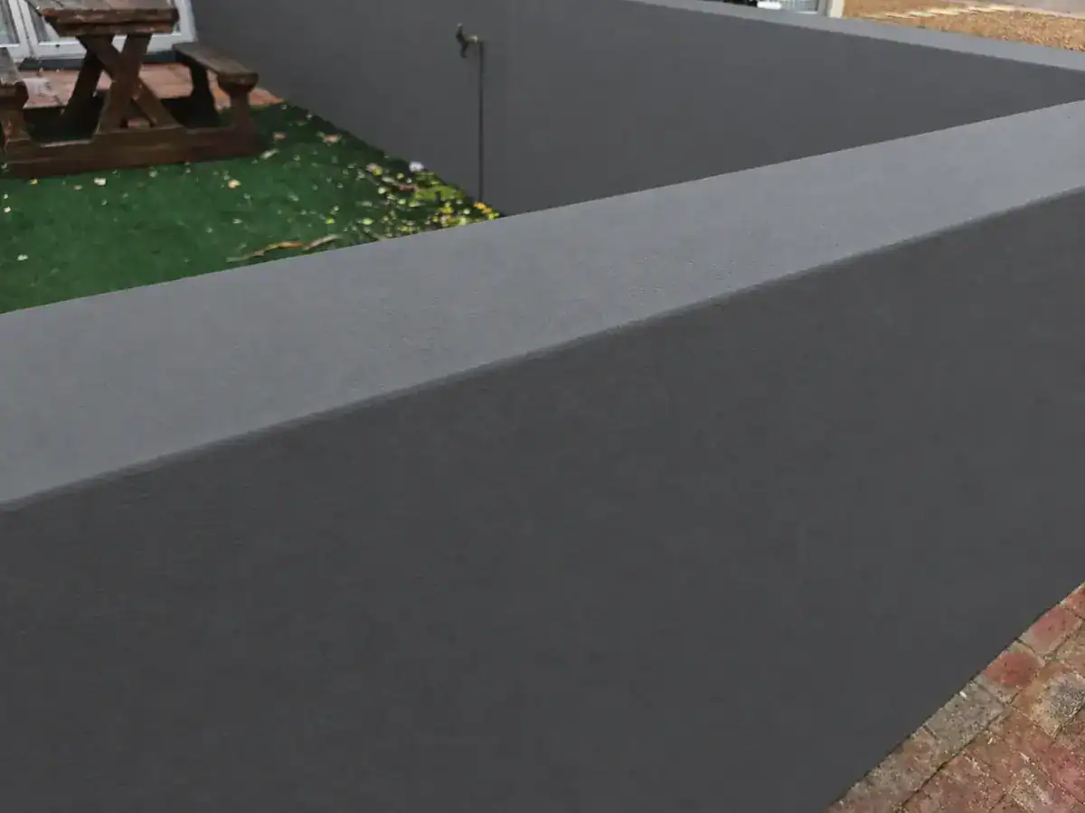 Repaired boundary-wall coping and wall finished in Monument Grey in Durbanville Hills.