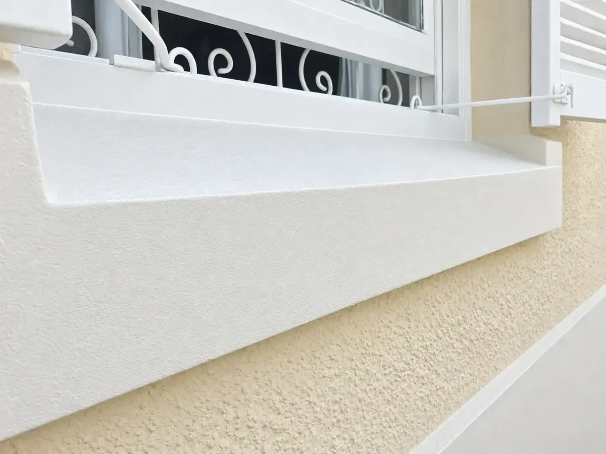 Exterior windowsill after waterproofing repairs and painting in Durbanville