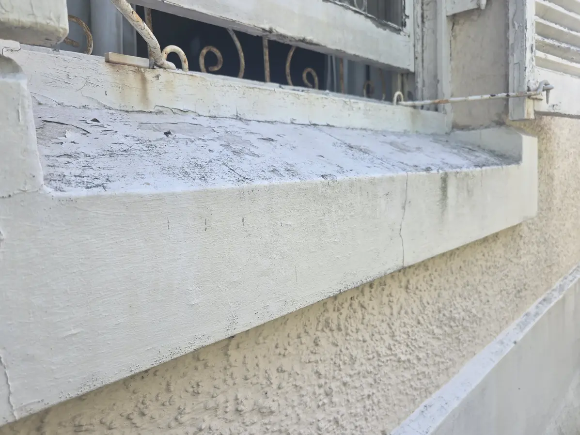 Weathered and cracked exterior windowsill before waterproofing and painting in Durbanville