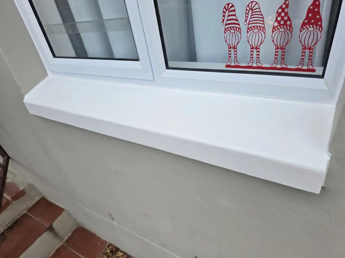 Completed exterior windowsill after crack repairs, waterproofing and repainting at a residential property in Gardens, Cape Town