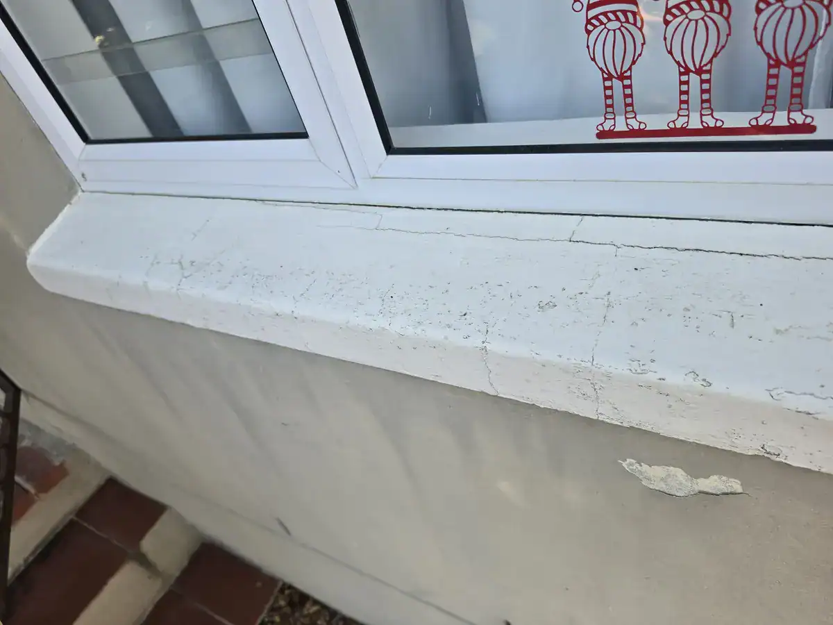 Cracked exterior windowsill before waterproofing and repainting at a residential property in Gardens, Cape Town
