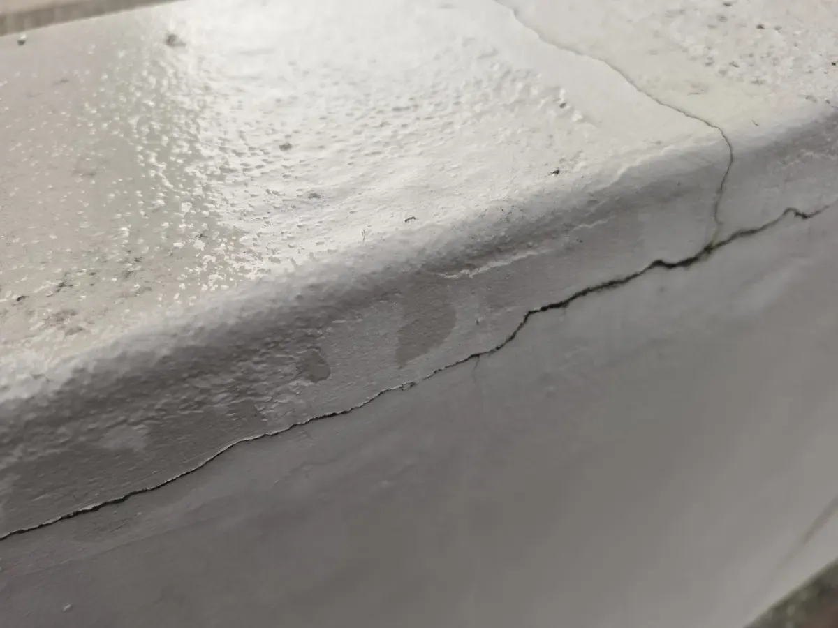 Cracked boundary wall coping before repairs at Nuutgevonden Estate Stellenbosch