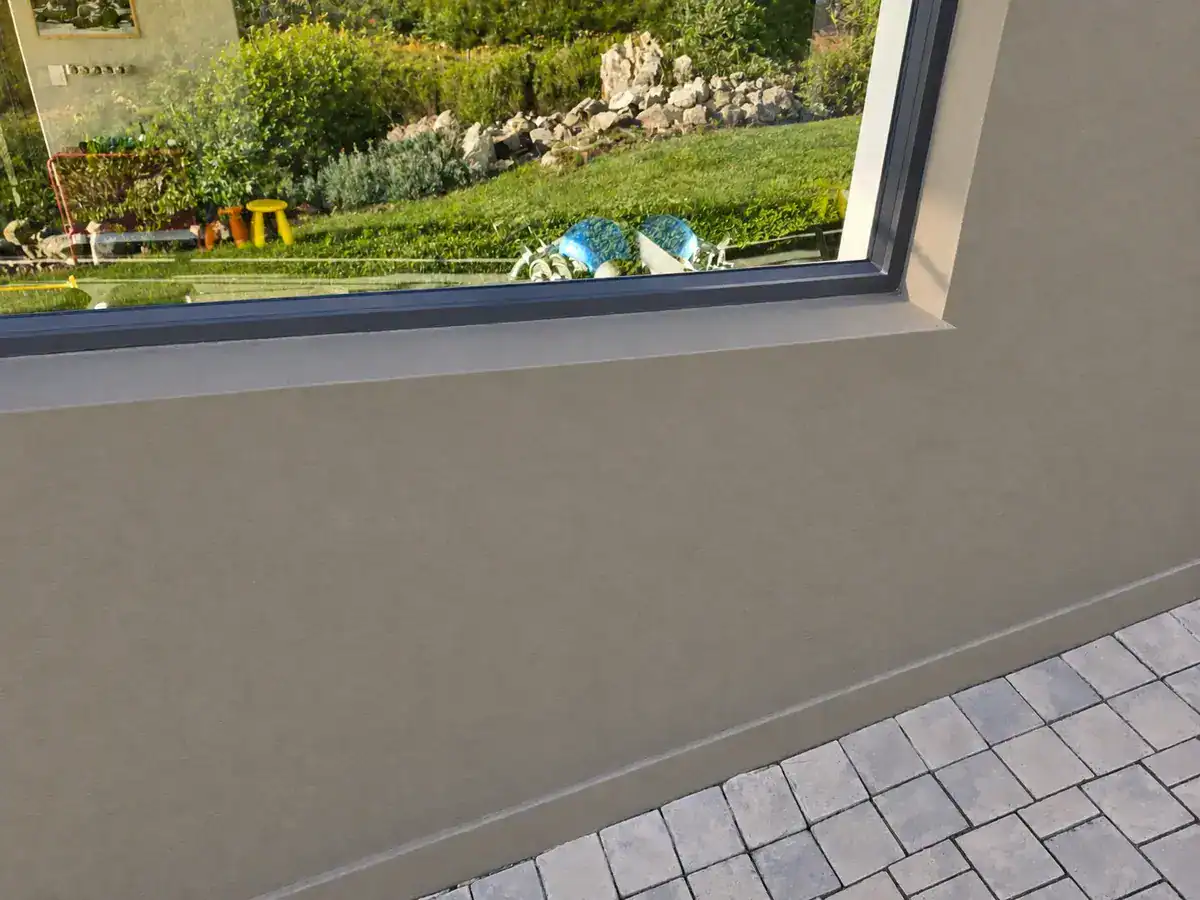 Repaired and repainted exterior wall below window at Nuutgevonden Estate Stellenbosch