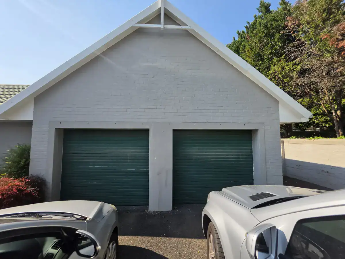 Garage exterior before preparation and repainting at a residential property in The Village, Oranjezicht