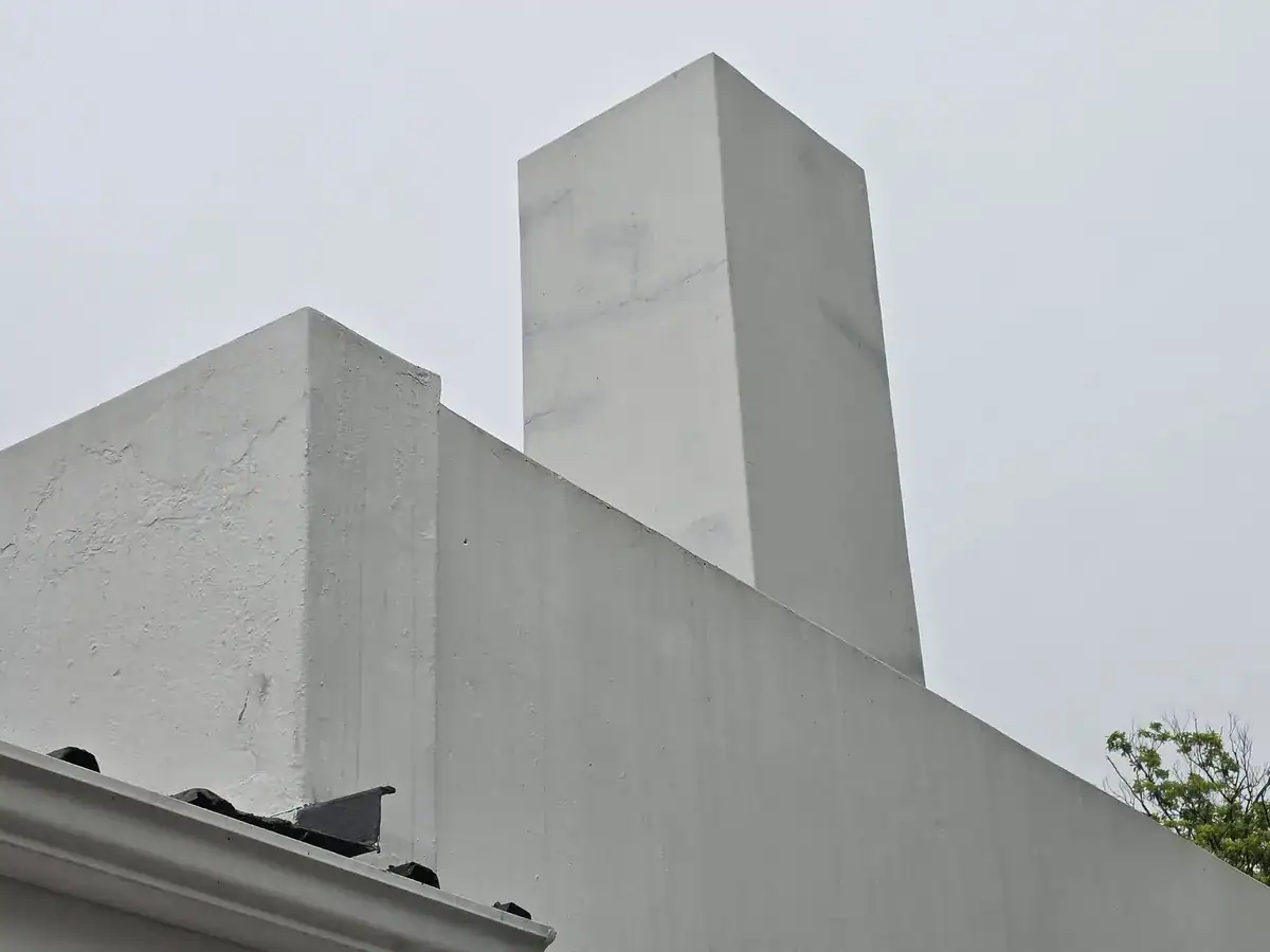 Chimney and exterior walls before preparation and repainting at a residential property in Upper Oranjezicht