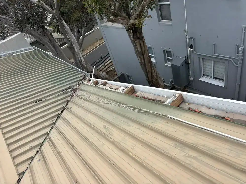 IBR roof before cleaning, priming and repainting at a property in Upper Vredehoek